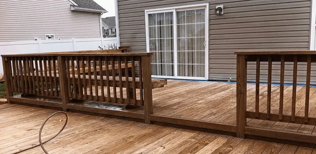 Deck sealing service protecting a backyard wood deck and railings in Fresno, CA