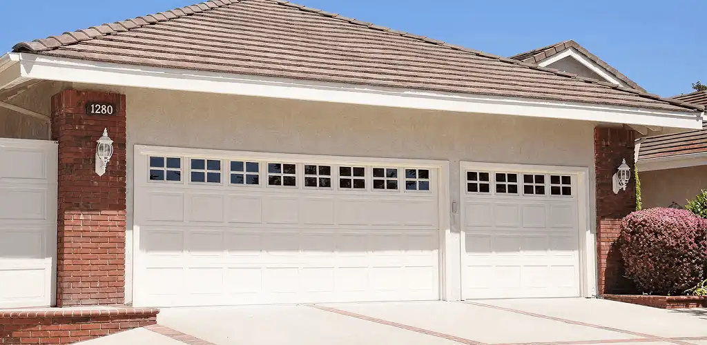 Residential garage door repair service for a double garage door in Fresno, CA
