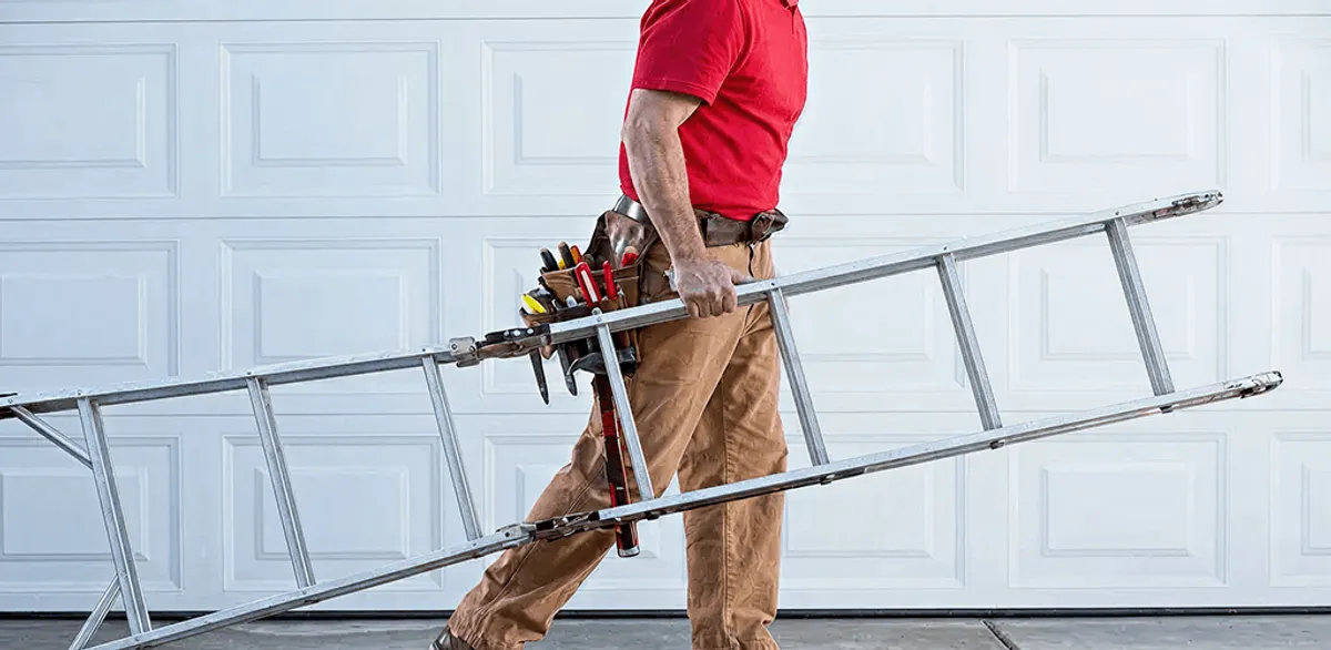 Garage door repair technician arriving with tools and ladder in Fresno, CA