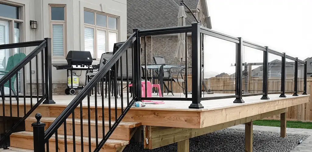 Handrail installation on a deck staircase for safety and code compliance in Fresno, CA